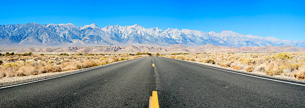 Panoramic highway to the mountains stock photo