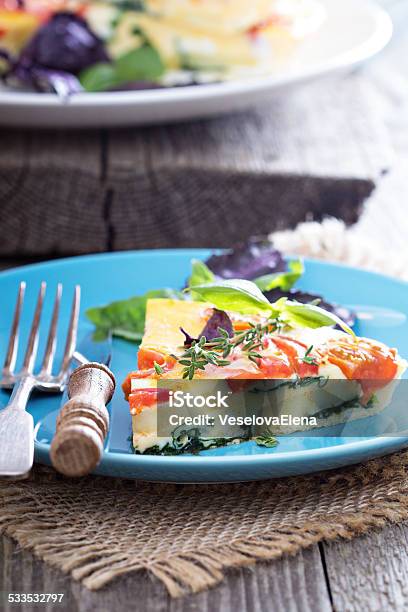 Frittata With Tomatoes Herbs And Potatoes Stock Photo - Download Image Now - 2015, Baked, Black Color