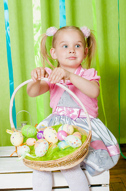 istock Little girl with  basket with Easter eggs 533534377