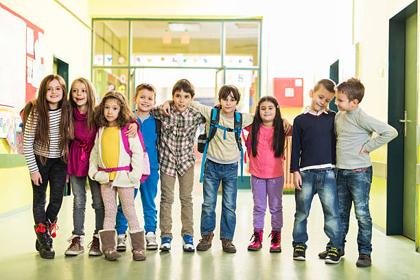 istock Embraced school children in the hall. 533535277