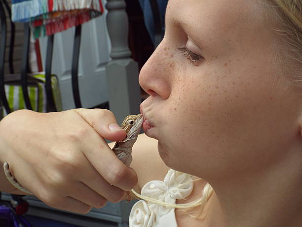 istock Girl kissing her pet 533535421