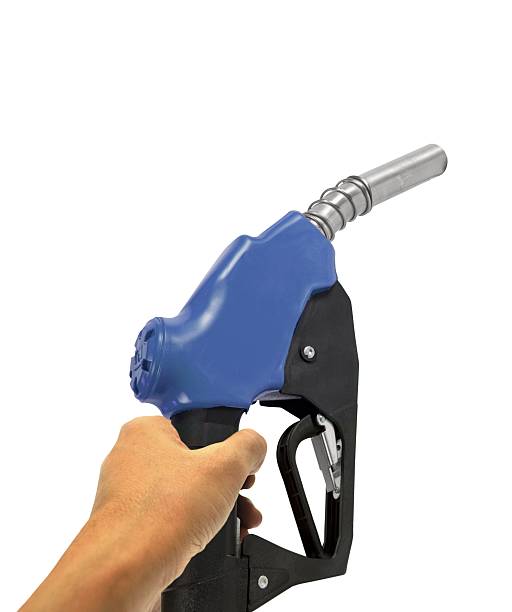 istock Hand holding petrol nozzle on white 533535627