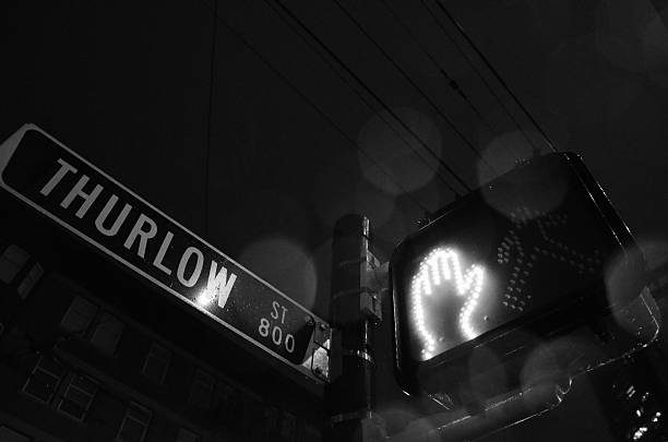 istock Black and white street sign at night 533536755