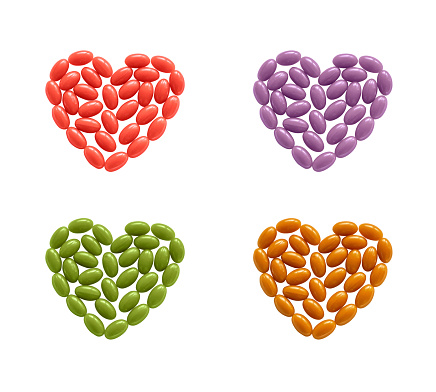 Hearts of coloful pills isolated on white background