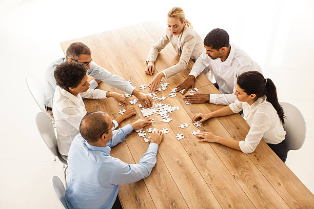 istock Business people putting jigsaw puzzle together 533538845