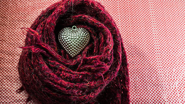 istock Silver heart on scarves decorated for Valentine's Day. Love conc 533539121