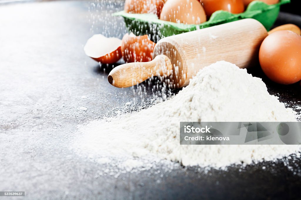 baking background baking background with raw eggs, rolling pin and flour 2015 Stock Photo