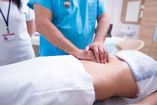 Doctor Controlling Patient stock photo