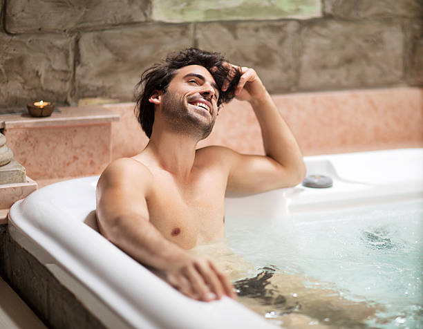 istock Smiling man enjoying in hot tub. 533551257