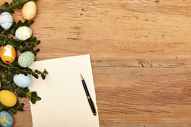 istock Easter eggs and twigs, blank card and ballpen on wood 533552193