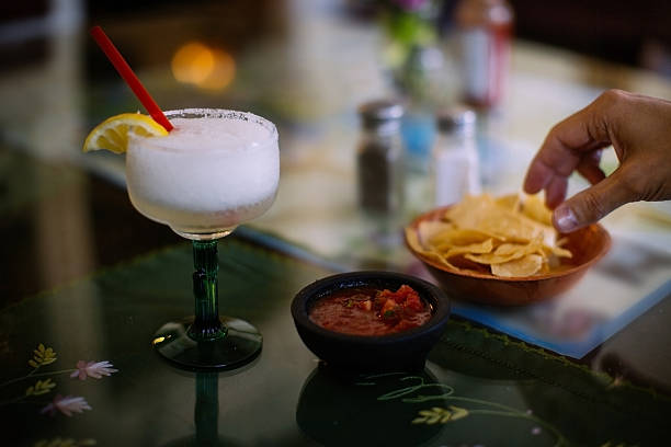 Margarita and corn chips in anticipation in a Mexican restaurant stock photo