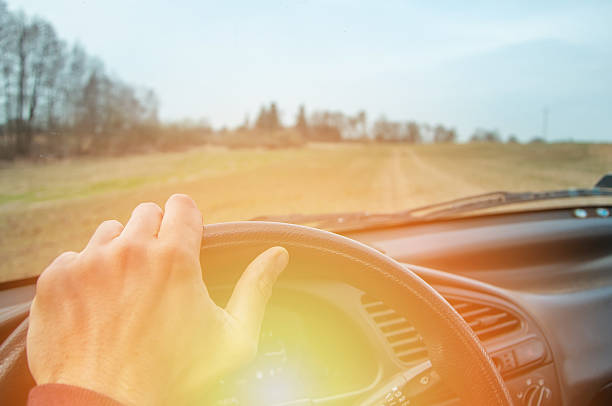 istock Driver's hands on the steering wheel inside of a car 533555612