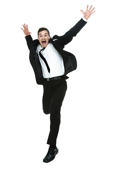 istock Excited businessman jumping with arms outstretched 533555961