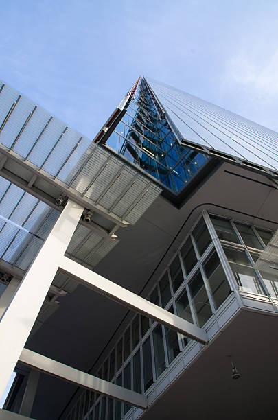 Close up of the Shard building of London from below Close up of the Shard building of London where we see only one corner of windows, seen directley from uder the shard close up stock pictures, royalty-free photos & images