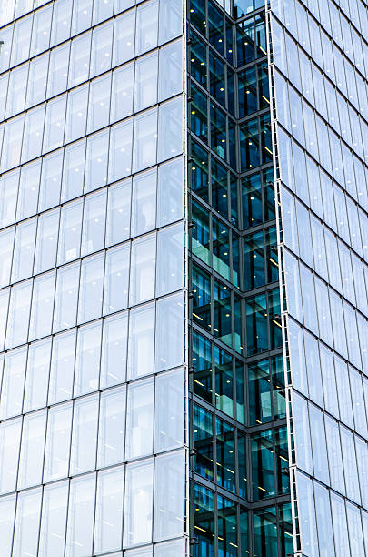 Close up of the Shard building of London Close up of the Shard building of London where we see only one corner of windows the shard close up stock pictures, royalty-free photos & images