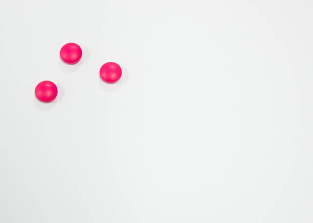 miniature pink drug model from Japanese clay on white background