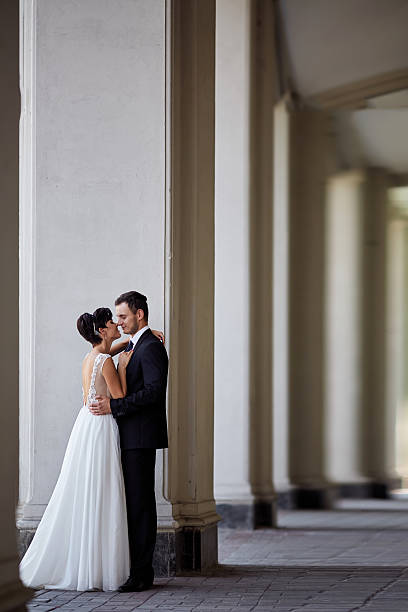 istock beautiful couple posing near the columns 533559770