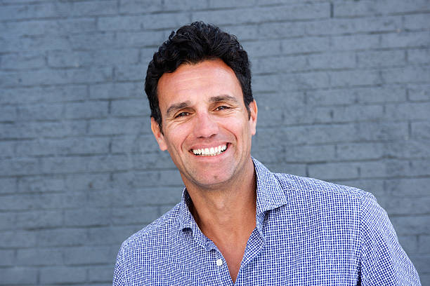 istock Close up portrait of a smiling handsome man 533560102