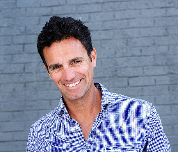 istock Close up portrait of a smiling attractive man 533560410