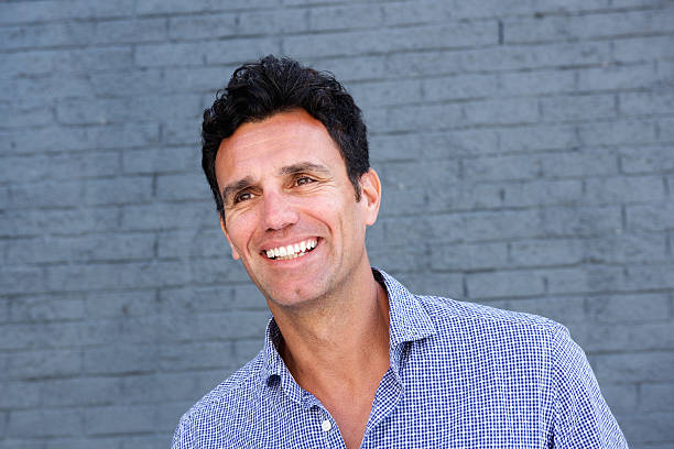 istock Close up portrait of a handsome older man smiling 533560738