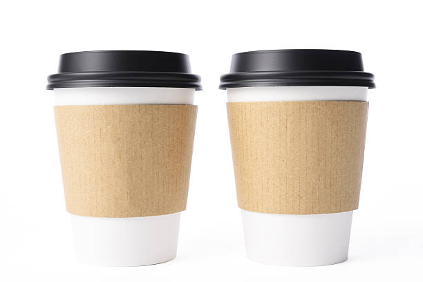 Isolated shot of two blank disposable cup on white background Two blank disposable paper coffee cup isolated on white background with clipping path. cup disposable cup paper insulation stock pictures, royalty-free photos & images