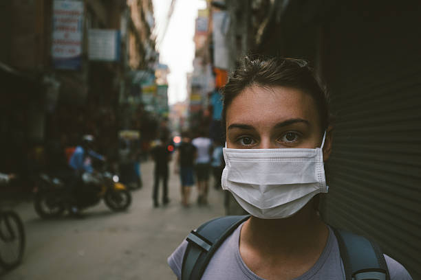istock Tourist girl with mask 533566676