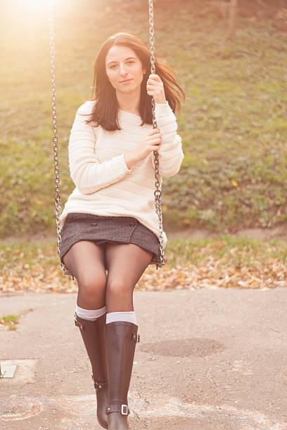 istock Girl swinging on a swing 533574459