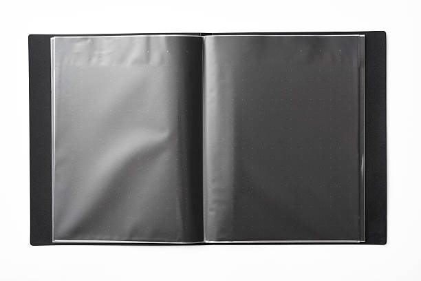 Overhead shot of opened blank black file folder, isolated on white background with clipping path.
