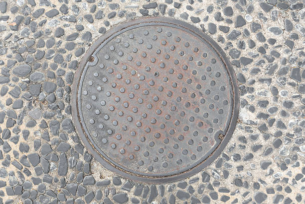 Rusty, grunge manhole cover Rusty, grunge manhole cover in original background sewer lid stock pictures, royalty-free photos & images