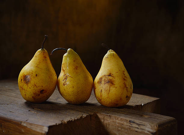 istock organic pears on an old cutting board 533576001