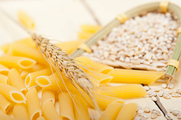 istock Italian pasta penne with wheat 533576414