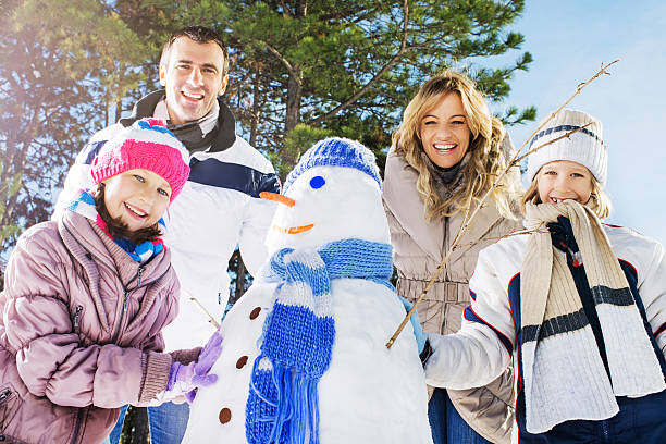 istock Happy family in winter park. 533576457