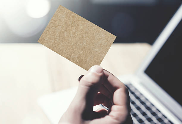 istock Closeup Image Man Showing Blank Craft Business Card and Using 533576840