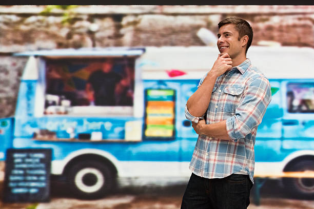 istock Smiling man thinking outdoors 533576914