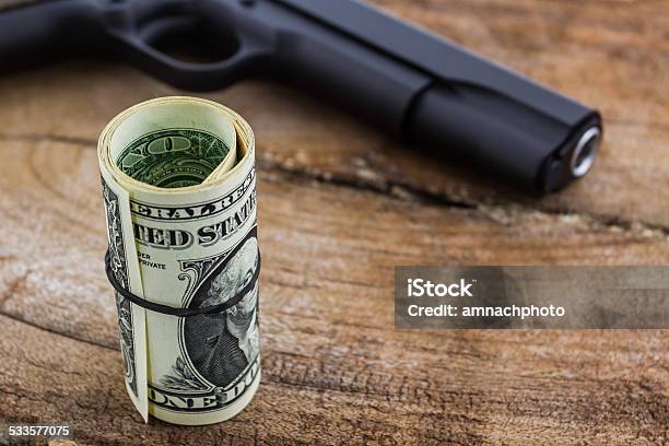 Close Up Money With Gun Stock Photo - Download Image Now - 2015, Ammunition, Bullet