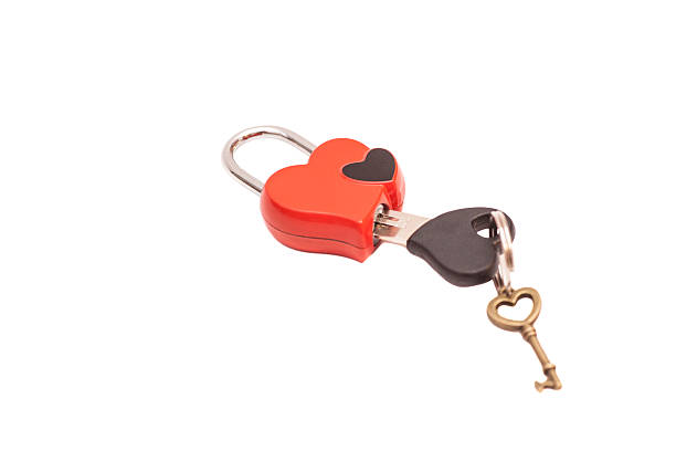 istock Red heart shaped padlock and keys isolated on white 533577437