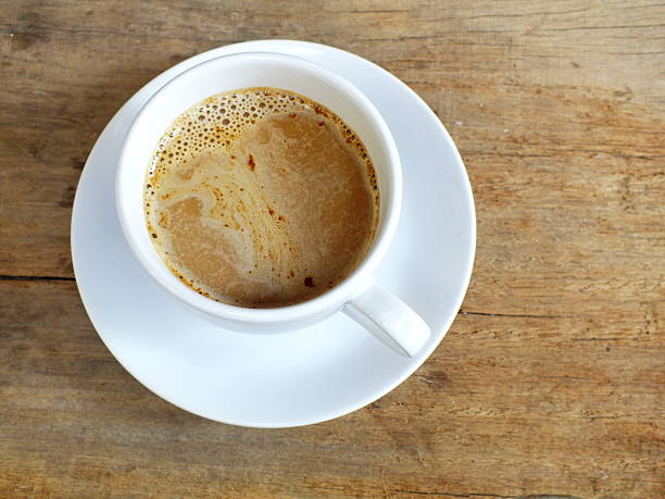 istock cup of coffee on a wooden table background 533577624