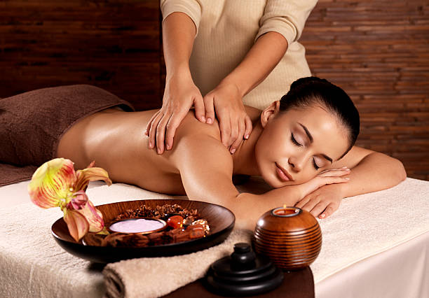 istock Woman having massage in the spa salon 533578068