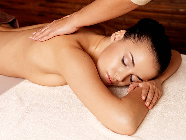 istock Woman having massage in the spa salon 533578142