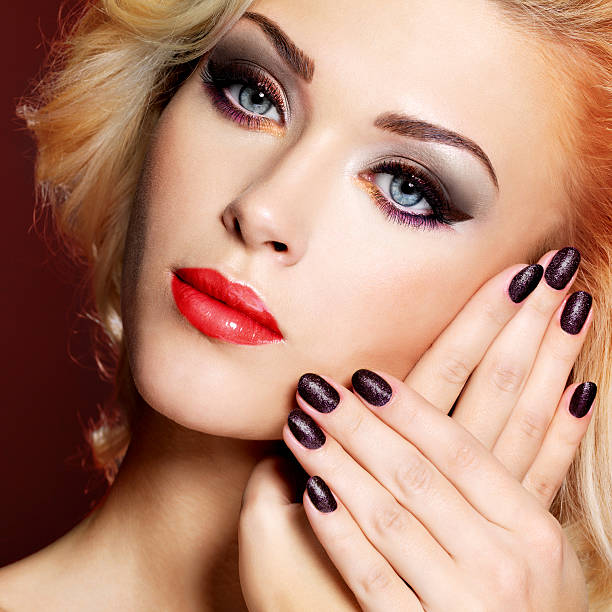istock Beautiful  woman with black nails and red lips 533578680