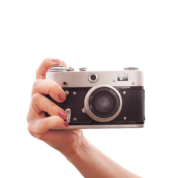 istock woman holding  retro camera on white background 533579381