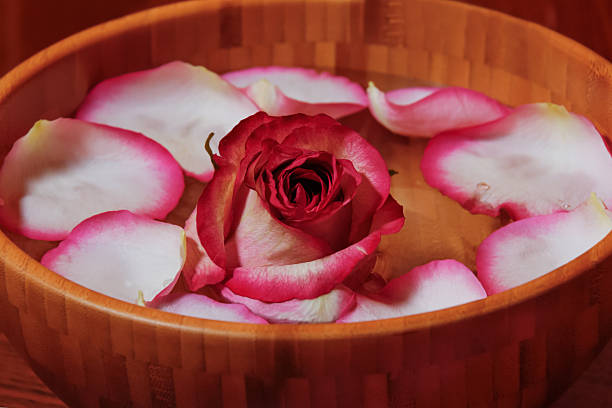 istock Rose petals and roses in bowl with water 533579587