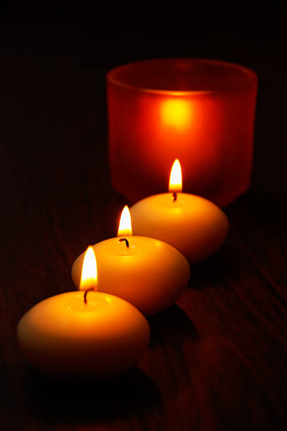 istock Glass candlestick and candles on wooden table 533579787