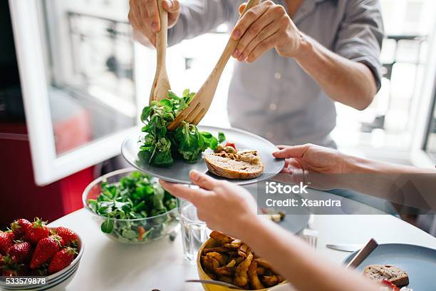 Friends Enjoying Lunch Stock Photo - Download Image Now - Healthy Eating, Eating, Food