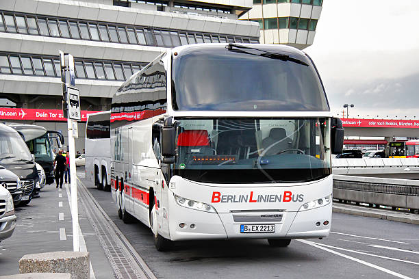 Neoplan N1216HD Cityliner Berlin, Germany - September 9, 2013: White Neoplan N1216HD Cityliner interurban coach drives at the city street. park designer label stock pictures, royalty-free photos & images