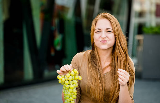 istock Teenager eating  grapes 533607643