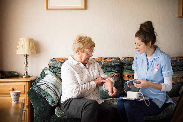 istock home visit blood pressure health check 533610769