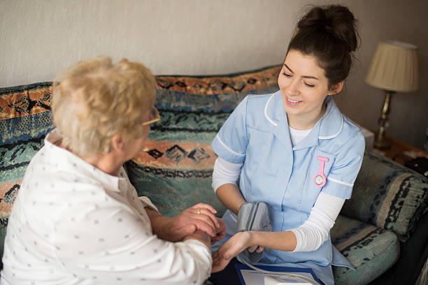 istock home visit blood pressure health check 533610781