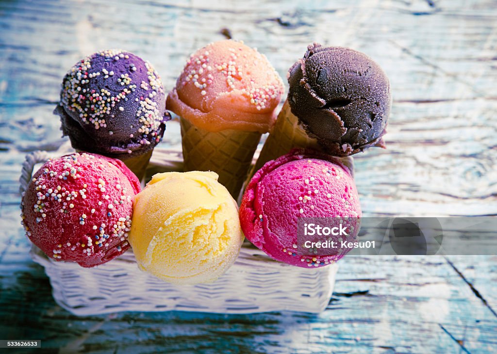 Ice cream scoops on wooden table. Ice cream scoops on wooden table, close-up. 2015 Stock Photo