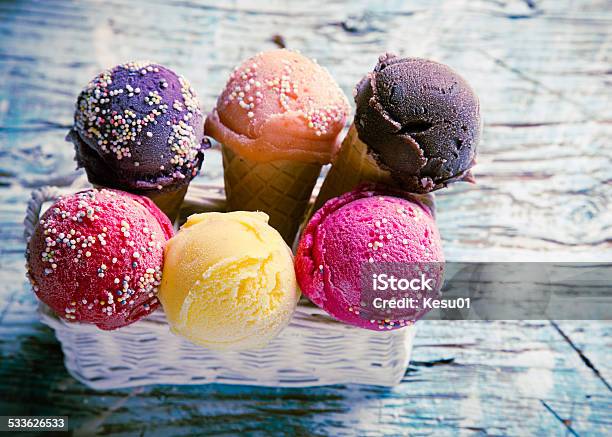 Ice Cream Scoops On Wooden Table Stock Photo - Download Image Now - 2015, Close-up, Cold Temperature